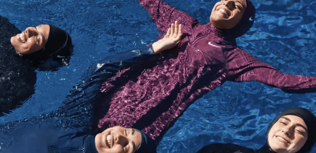 muslim sisterhood floating in nike swim swimwear