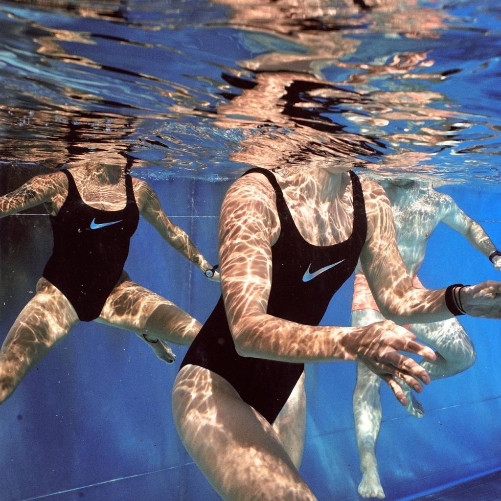 models underwater wearing nike swim swimsuits