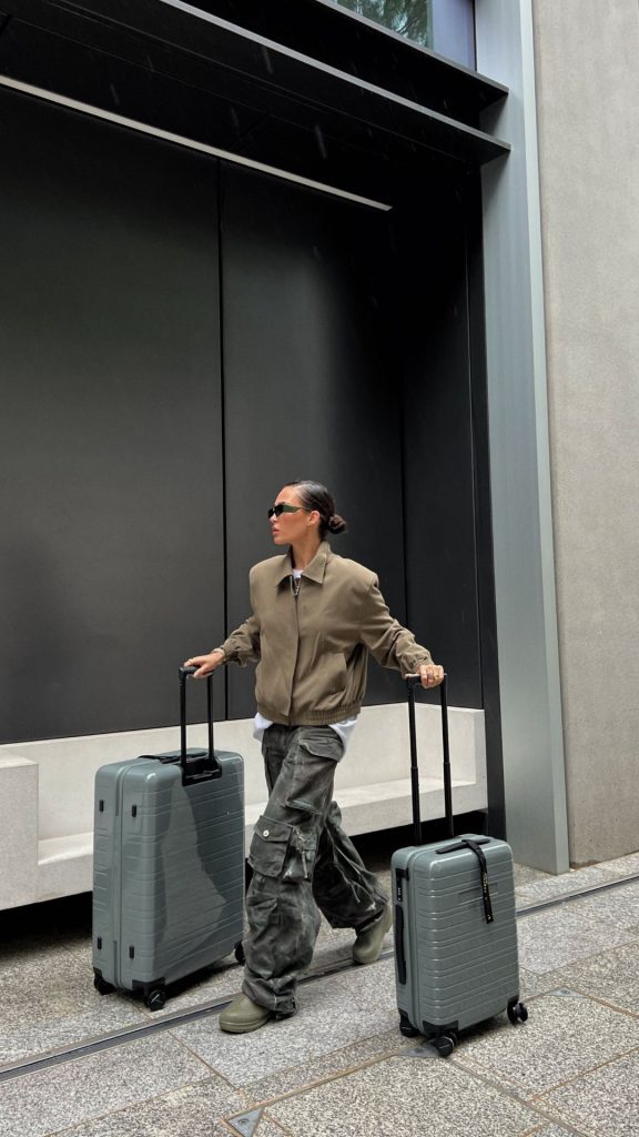 woman carrying suitcases