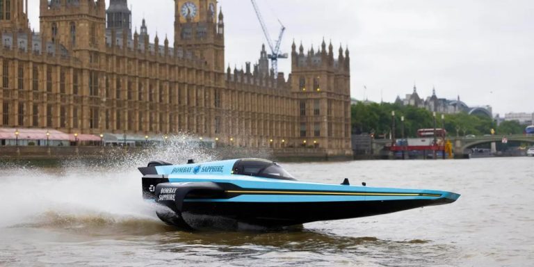 An E1 RaceBird on the River Thames in front of the Houses of Parliament.