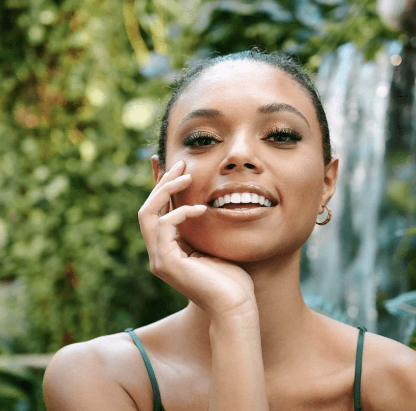 female model holding face wearing velour lashes
