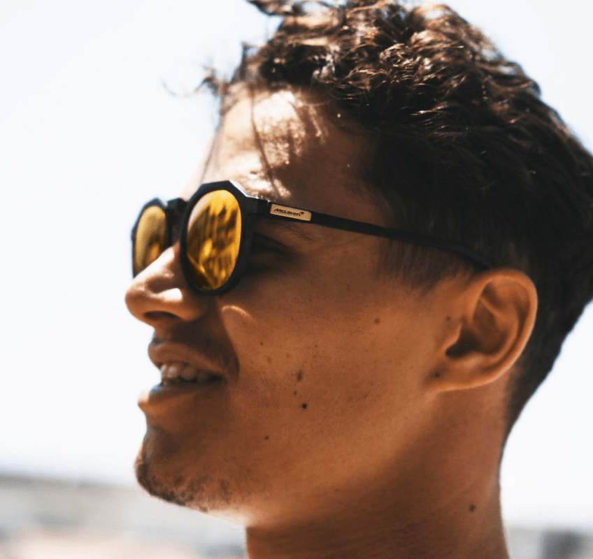 mclaren f1 driver wearing sungod sunglasses