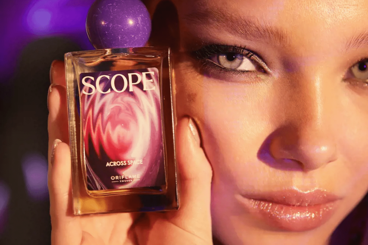 woman holding perfume