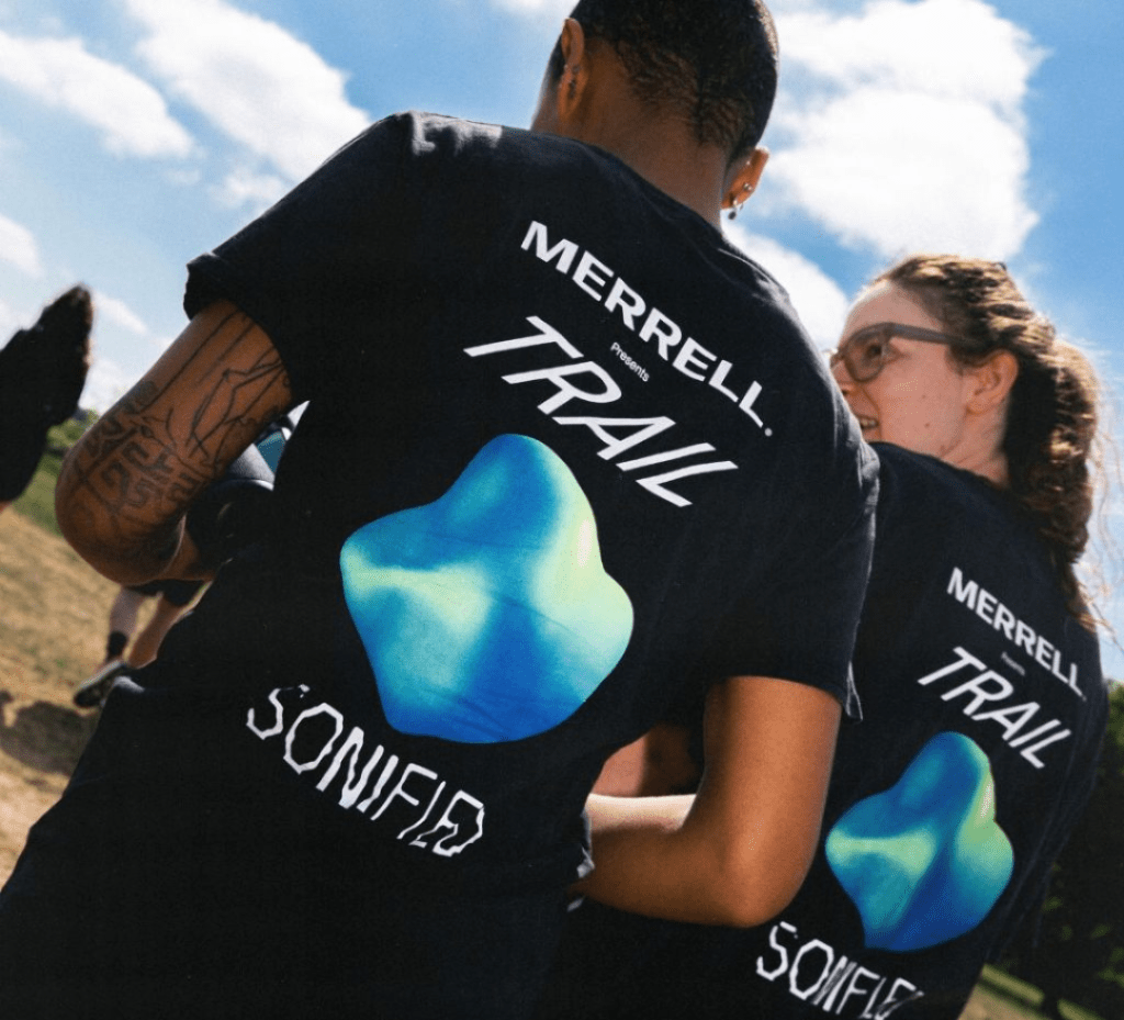 two people wearing merrell t-shirts