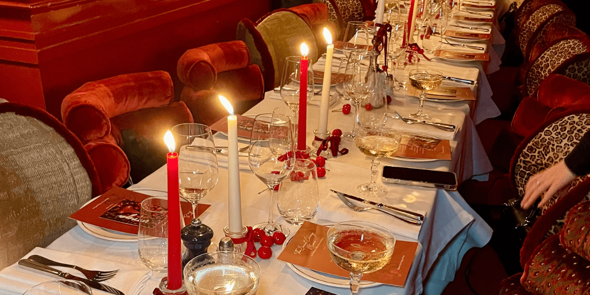 dinner table with red velvet seats