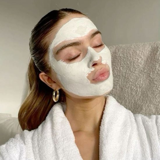 Woman pouting with face mask on