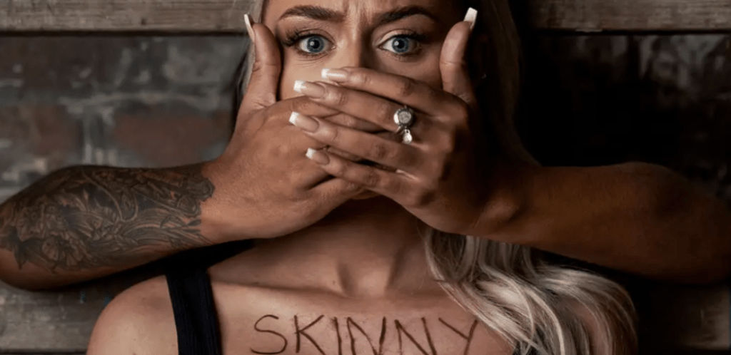 woman with hands covering mouth on st moriz cybersmile photoshoot
