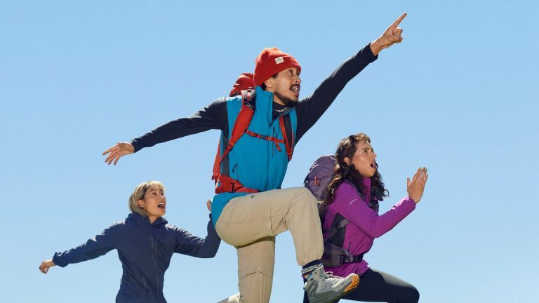 people jumping and pointing in search