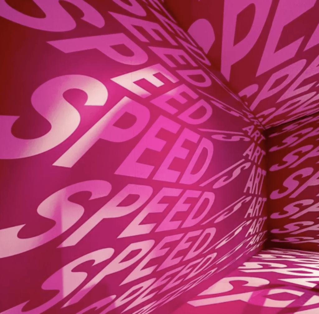 saucony pink gym with speed is art on walls