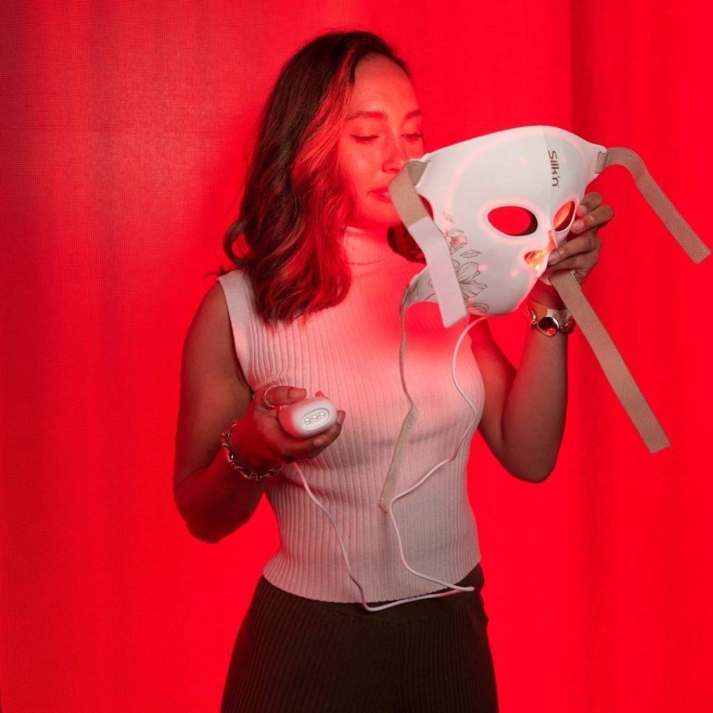 Woman at beauty PR event trying a Silk'n LED face mask