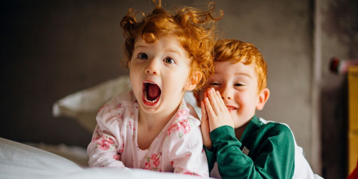 Two children smiling.