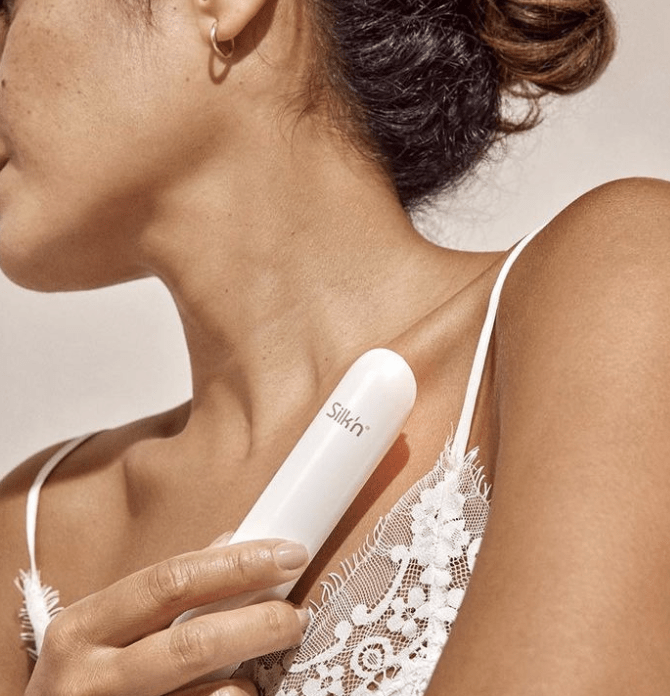 female model posing with silkn product