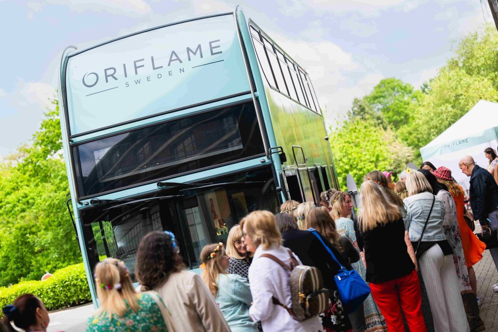 oriflame beauty bus by brandnation showing queue outside exterior