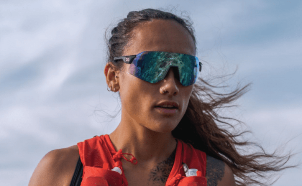 woman in sungod sunglasses