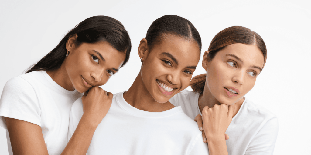 three women next to each other smiling