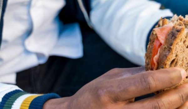 person holding a sandwich