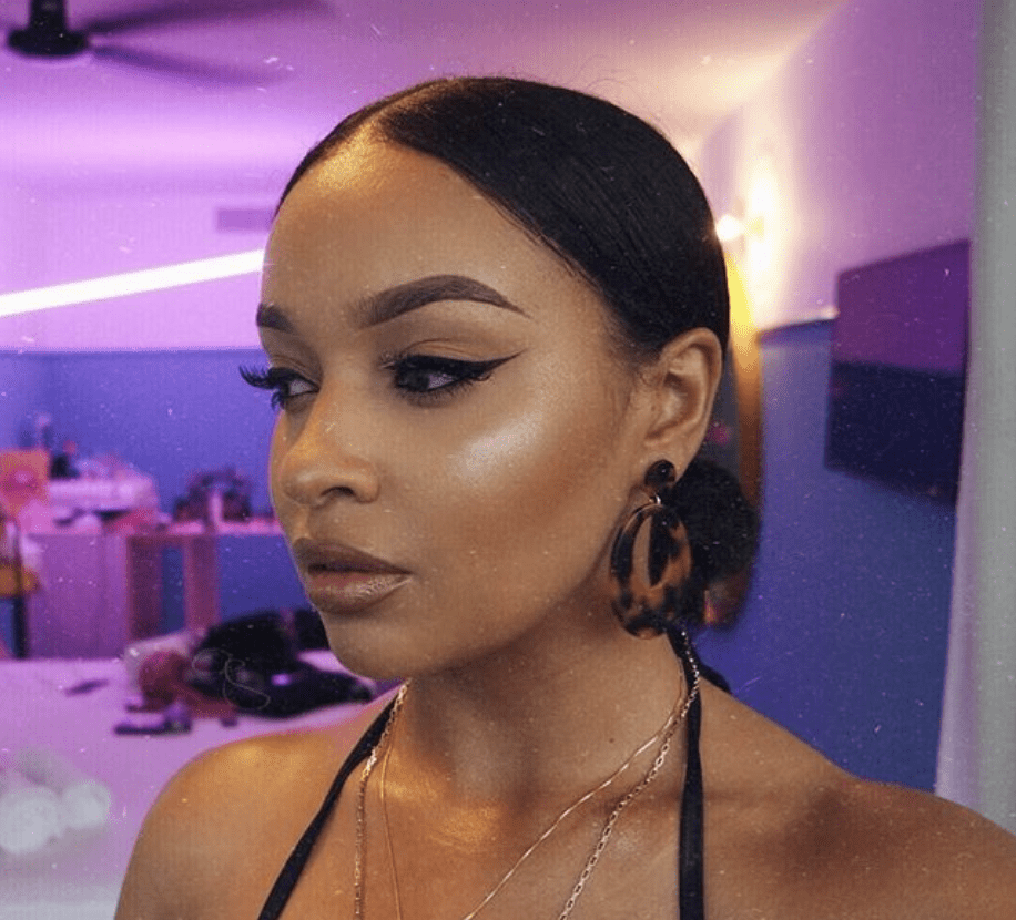 female model with sleek makeup applied to face