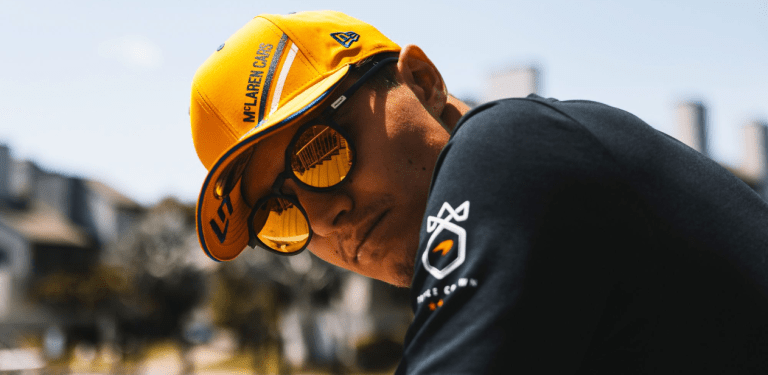 mclaren f1 driver wearing sungod sunglasses